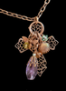 Necklace of a cross adorned by a Busy Bee Charm.
